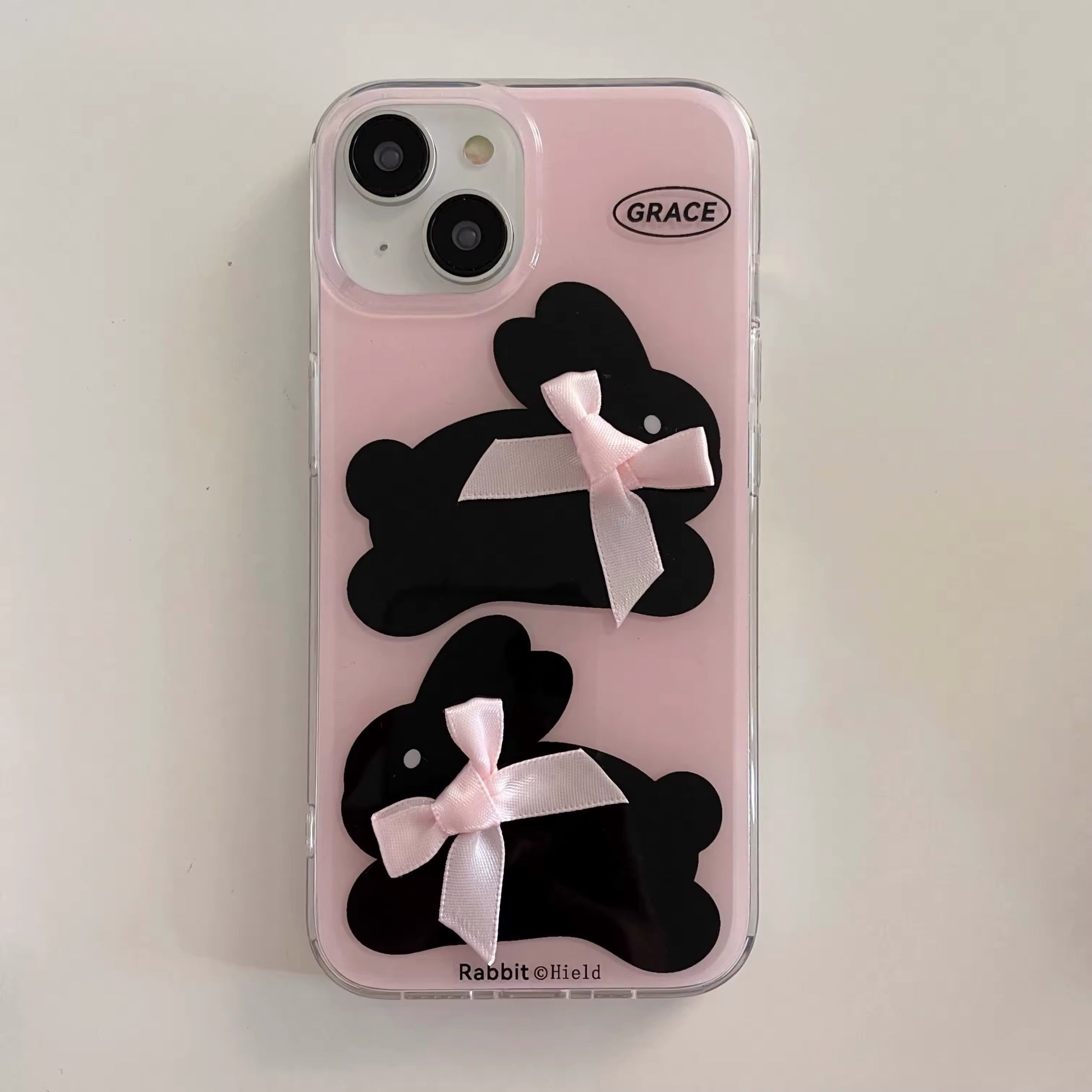 Shockproof pink iPhone case featuring a kawaii rabbit design