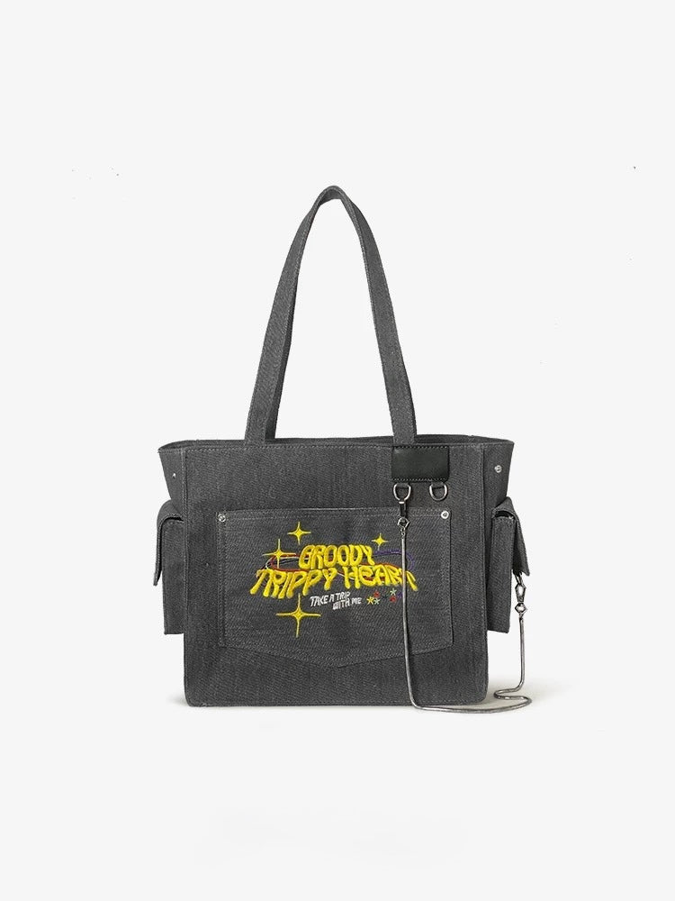 Groovy embroidery on gray canvas handbag with rings