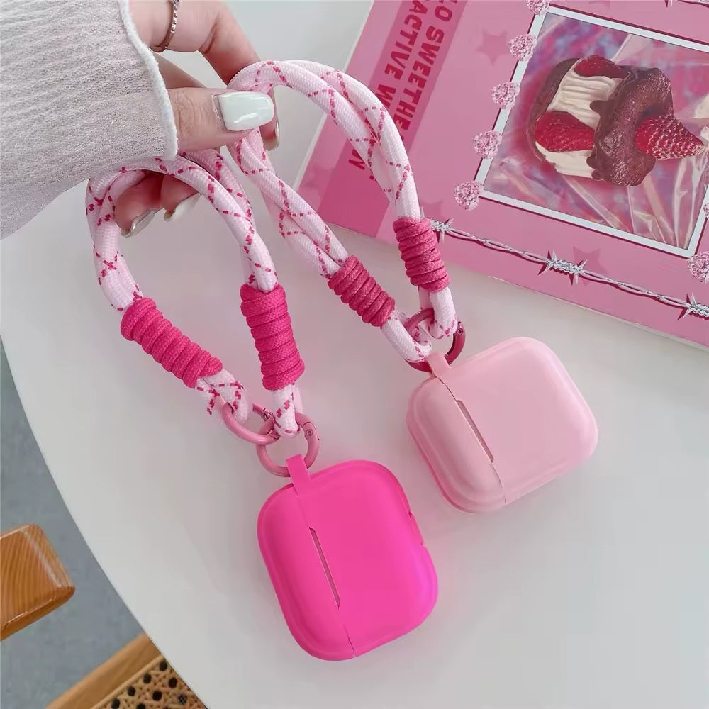 Preppy pink AirPods case with soft silicone body and heart pendant