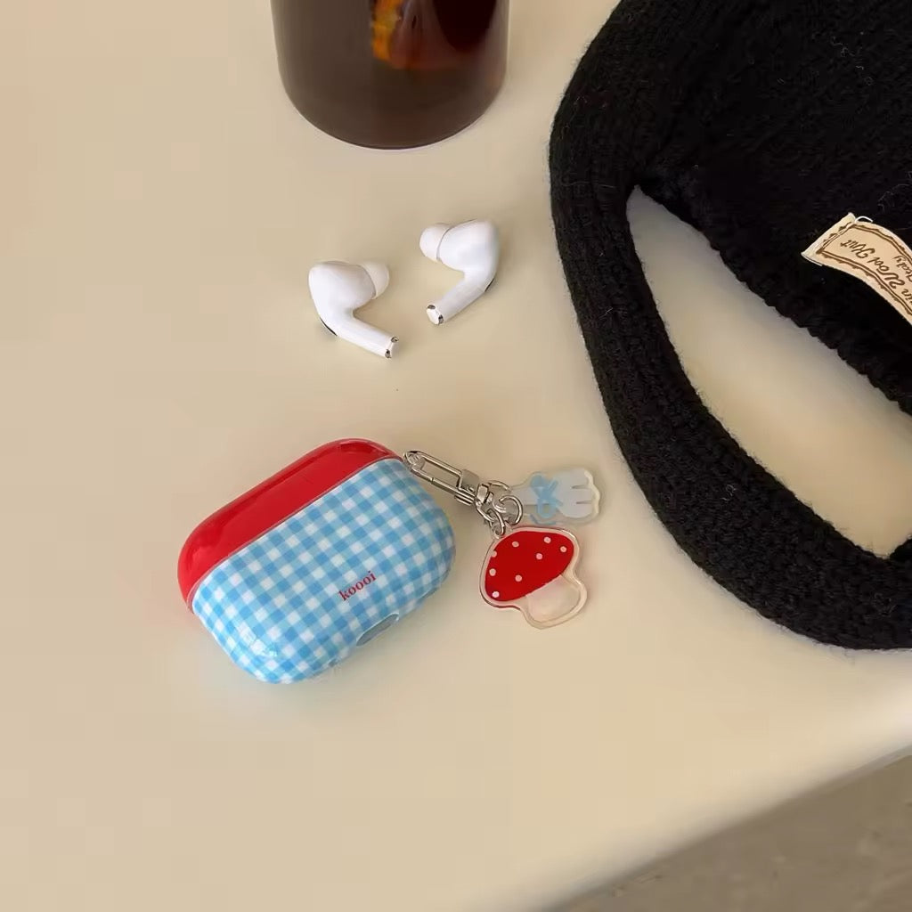Kidcore-inspired AirPods cover with mushroom keychain