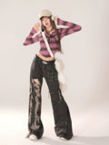 Model wearing the jeans with a cropped top, illustrating the Y2K streetwear ensemble.