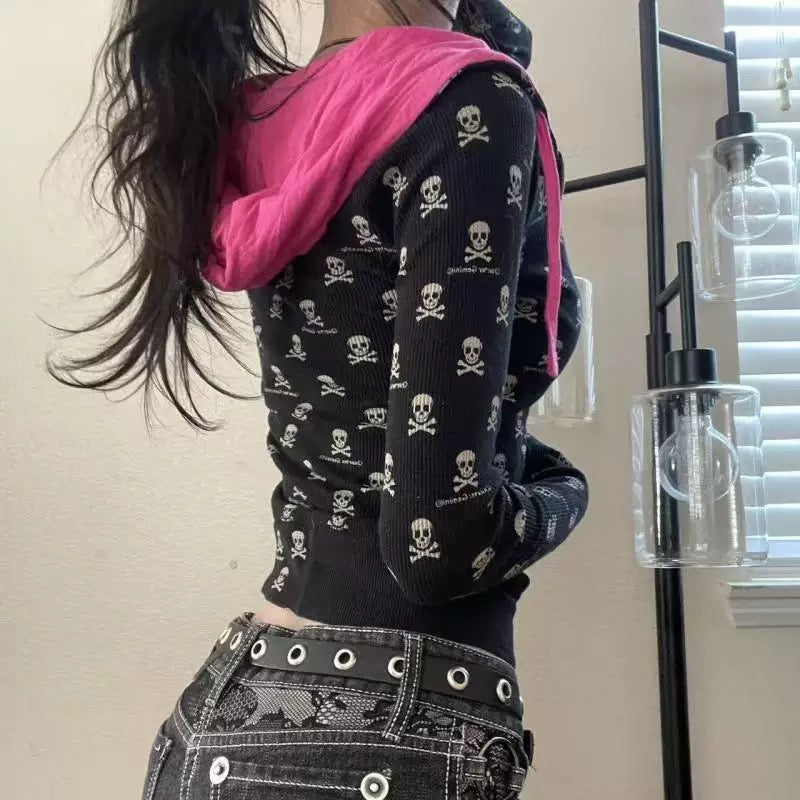Close-up of black skeleton hoodie with all-over skull print design.