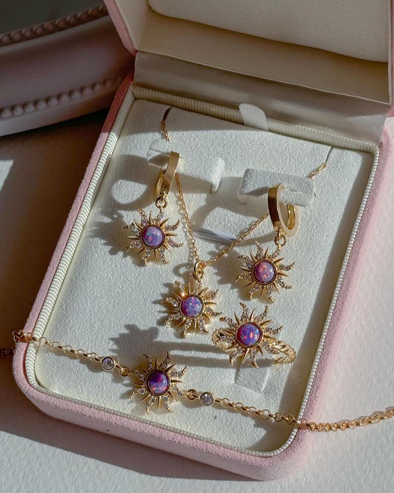 Close-up of Rapunzel-inspired opal sun pendant necklace with intricate zircon details.