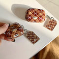 Brown plaid AirPods holder with detachable bow keychain tag