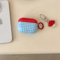 Retro blue checkered AirPods case with mushroom charm