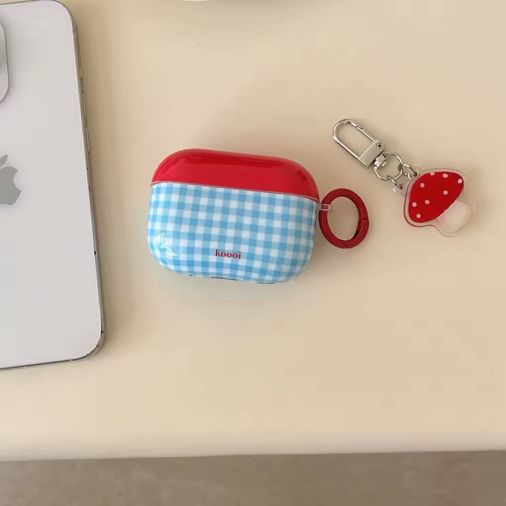 Retro blue checkered AirPods case with mushroom charm