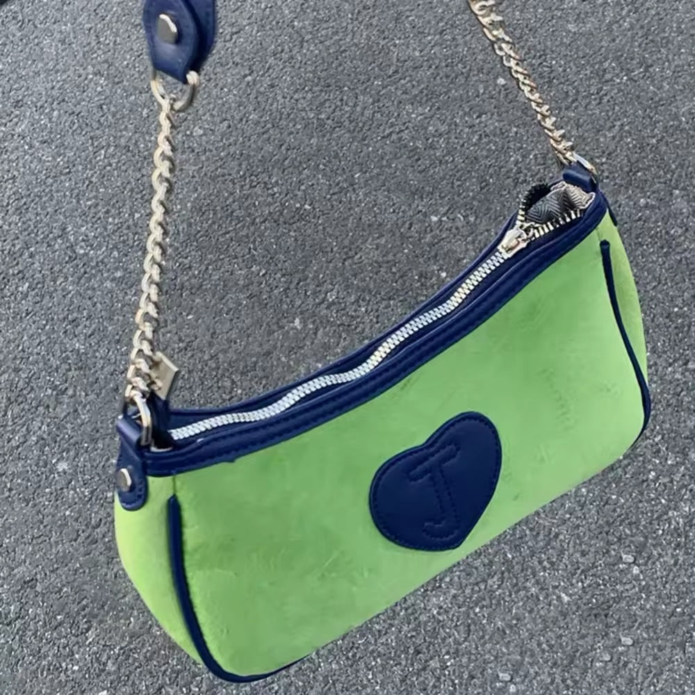 Front view of the Retro Green Velvet Shoulder Bag showcasing heart-shaped embroidery