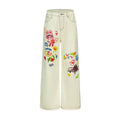 Colorful “PARTY TIME” print with playful hand-drawn elements on the leg of the pants