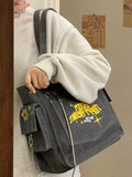 Washed canvas gray shoulder bag with vintage text design