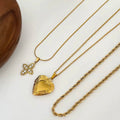 Elegant stainless steel twisted chain necklace with cross and heart charm