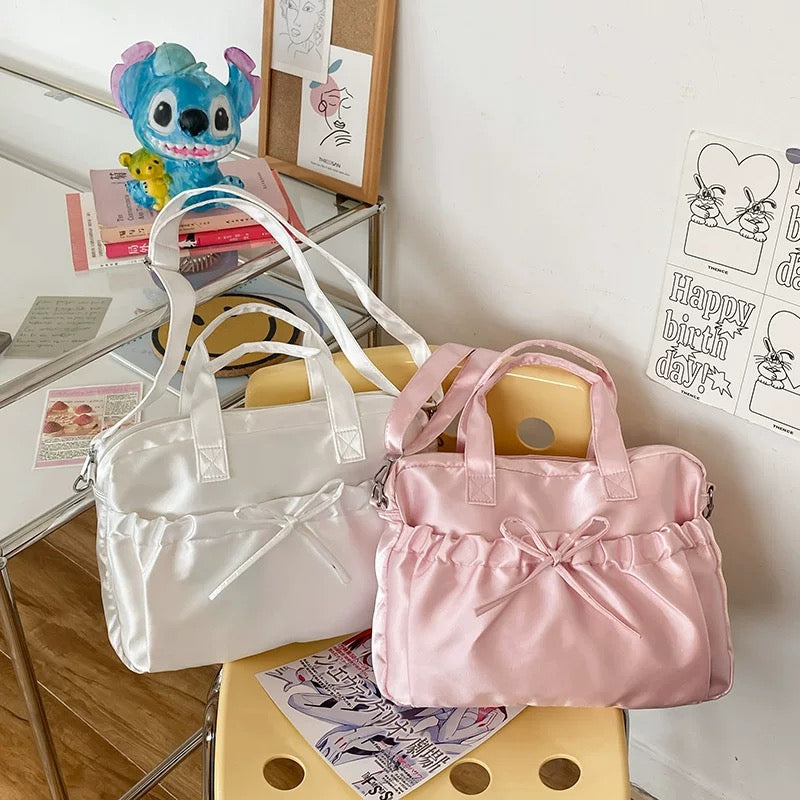 Satin balletcore laptop bag with soft ruffled bow and glossy finish, ideal for aesthetic outfits and everyday use