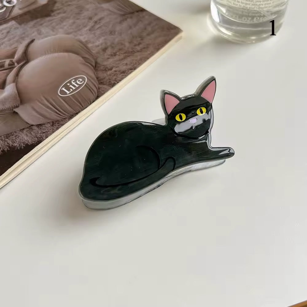 The clips styled as accessories on a desk with a retro book and minimal decor, highlighting Y2K vibes