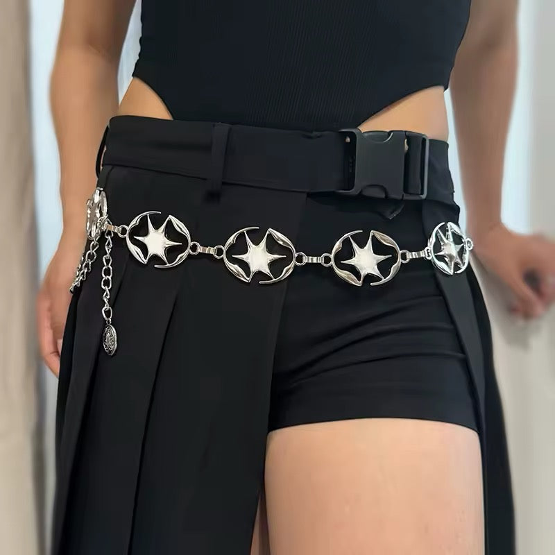 Silver Y2K chain belt with star details styled on jeans