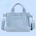 Close-up of embroidered Snoopy and Woodstock on denim tote