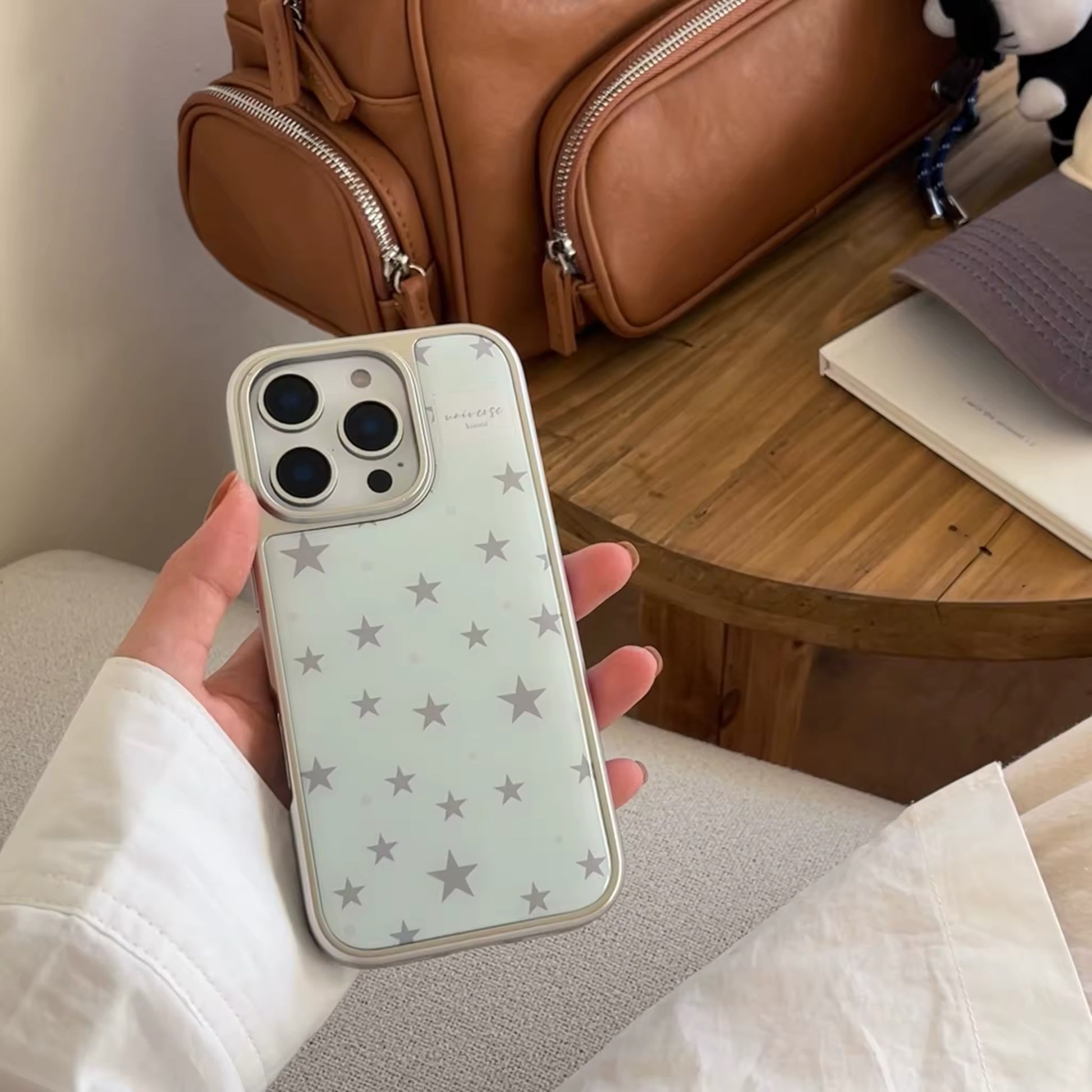 The case in a flat lay with other Korean-style fashion items