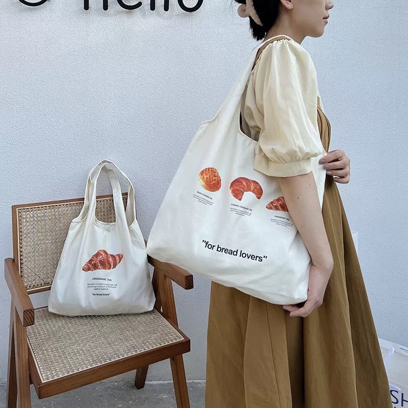 Model carrying the tote, styled with a soft girl outfit.