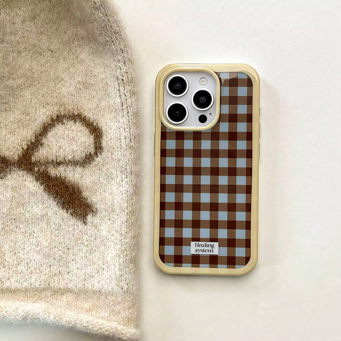 Front view of the Brown Checkered iPhone Case showcasing the retro design