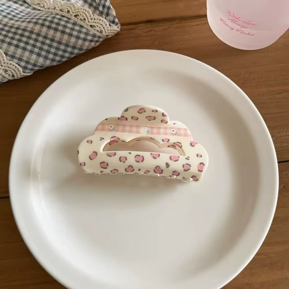 Blue heart-shaped hair claw clip with pink plaid centers, styled for a soft girl or balletcore look