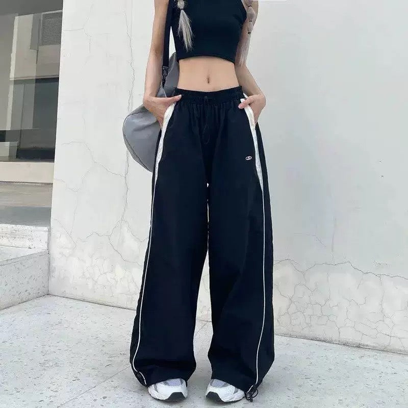 y2k black pants with white stripe design