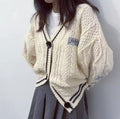 Beige single-breasted cardigan styled with boots