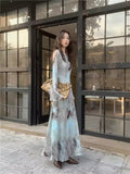 Dress laid flat on a white surface showing the silhouette