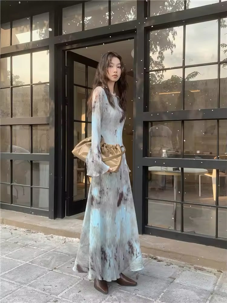 Dress laid flat on a white surface showing the silhouette