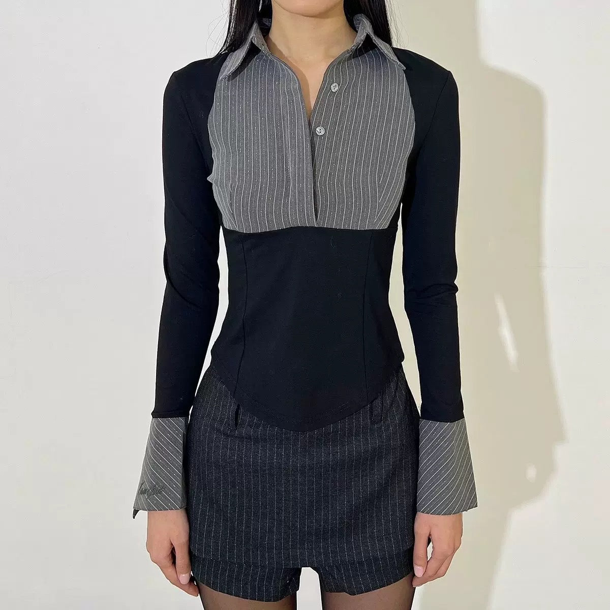 Black and gray patchwork button-up blouse for a sleek retro look