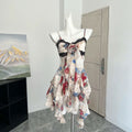 Y2K-inspired vintage gyaru crop top with lace ruffle trim and halter neck, featuring irregular hem and soft oil painting print
