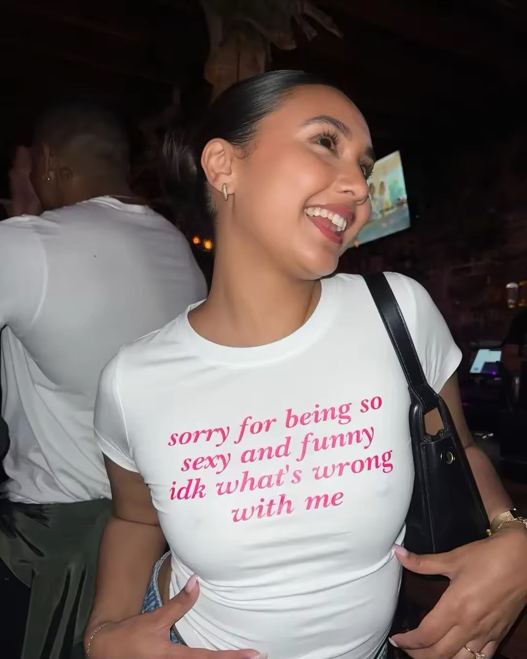 Close-up of Harajuku-inspired letter graphic on vintage Y2K crop top