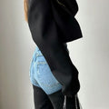 Retro Y2K jeans with bold patchwork design and functional zipper pockets, flattering silhouette for spring and summer streetwear