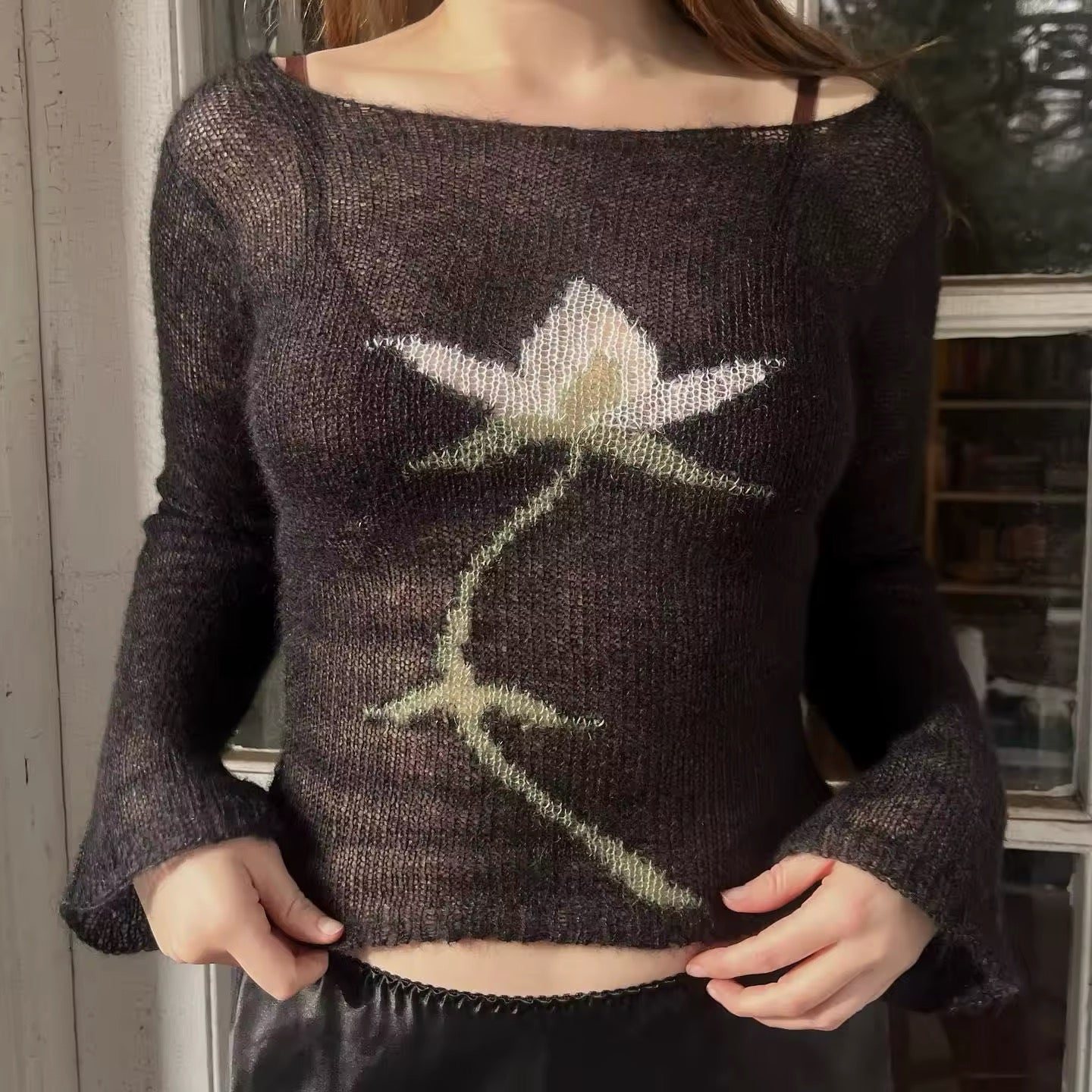 Casual Y2K flower knit top laid flat on white fabric background
