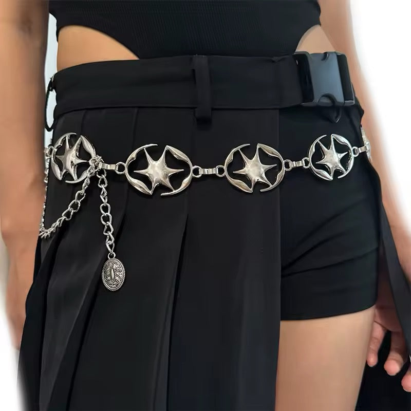 Silver Y2K chain belt with star details styled on jeans