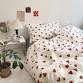 Bedding set with red heart pattern in a bedroom setting