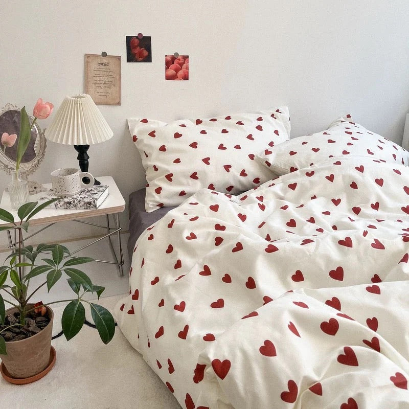 Bedding set with red heart pattern in a bedroom setting