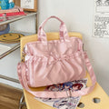 Glossy satin laptop bag in black with romantic pleated design for aesthetic fashion lovers