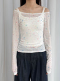 Slim base layer top for women featuring black stars on white fabric, lightweight and flattering for everyday wear