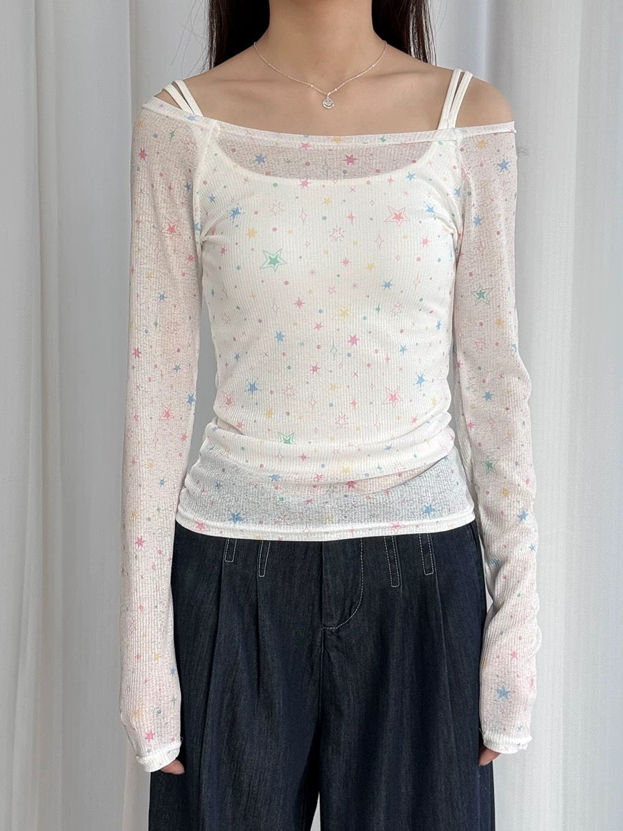 Slim base layer top for women featuring black stars on white fabric, lightweight and flattering for everyday wear