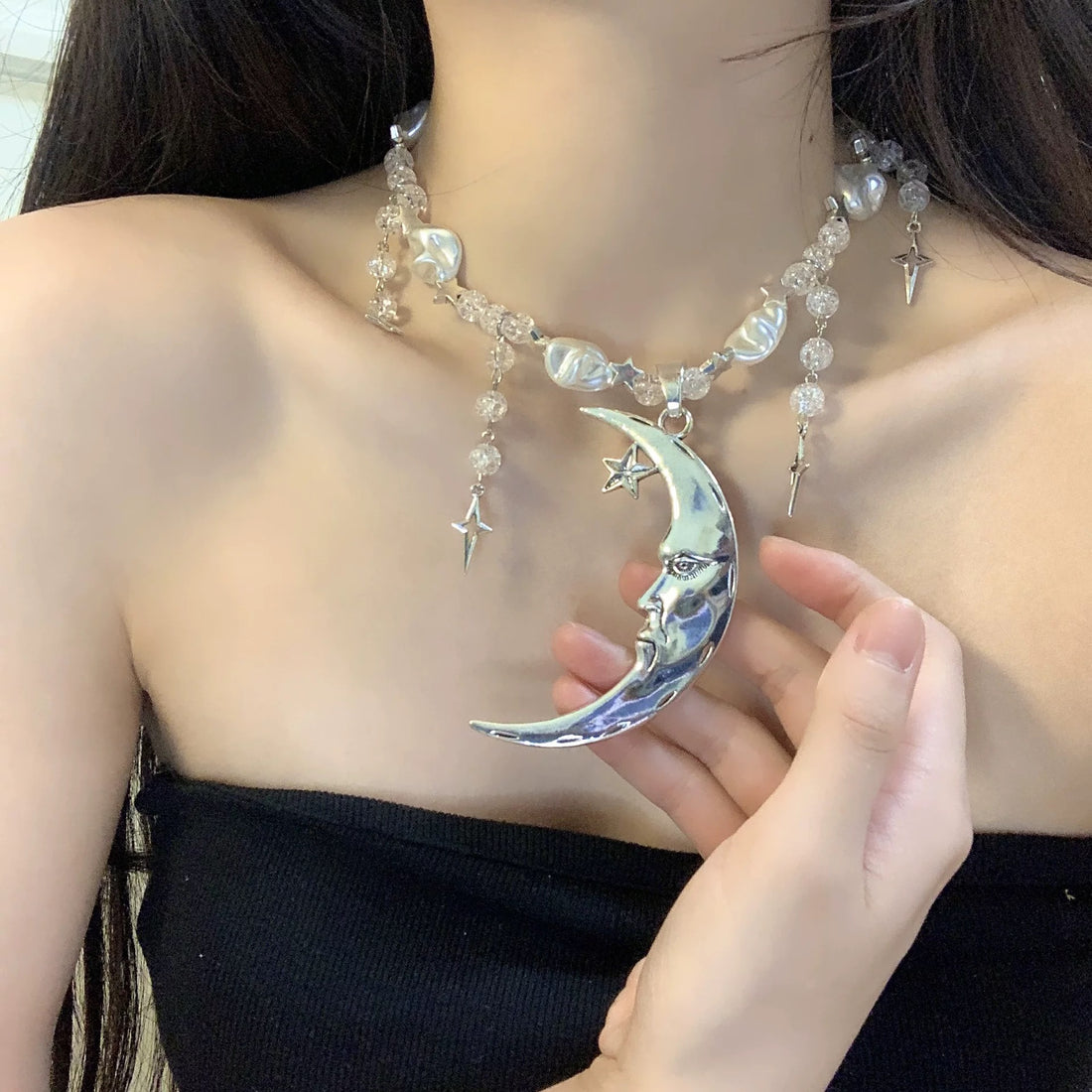 Y2K aesthetic pearl choker with a celestial moon and star pendant, luxury vintage-inspired jewelry for spiritual and mystical fashion lovers