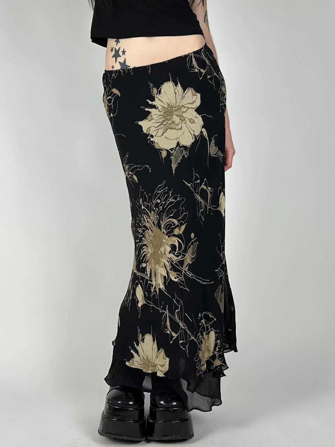 Front view of the dark floral mesh midi skirt showcasing its double-layered A-line design.