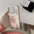 The iPhone case displayed on a pastel-themed desk setup, complementing balletcore decor