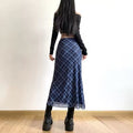 Elegant plaid midi skirt with a retro preppy style
