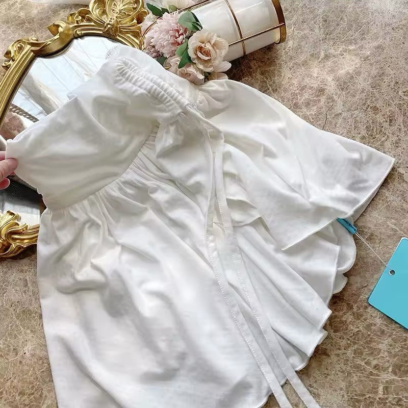 Coquette-inspired white short skirt with ruffle details
