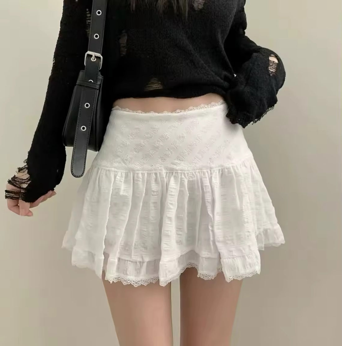 Model twirling in soft girl balletcore skirt