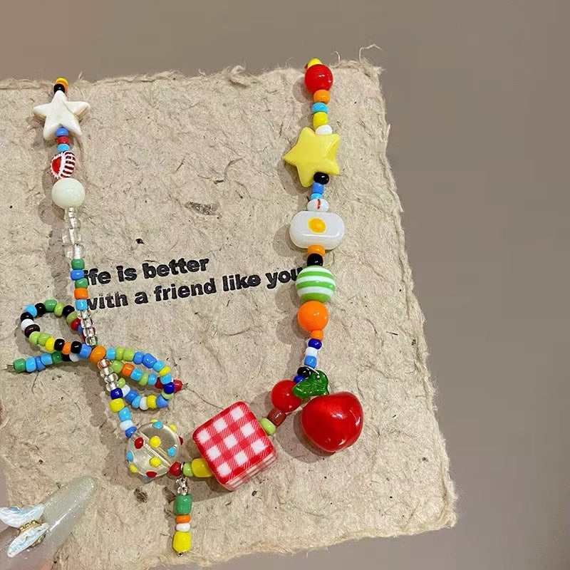 Y2K fruit bow colorful necklace featuring cute cartoon fruit charms, pastel beads, and star pendants for Harajuku, EMO, and egirl aesthetic outfits