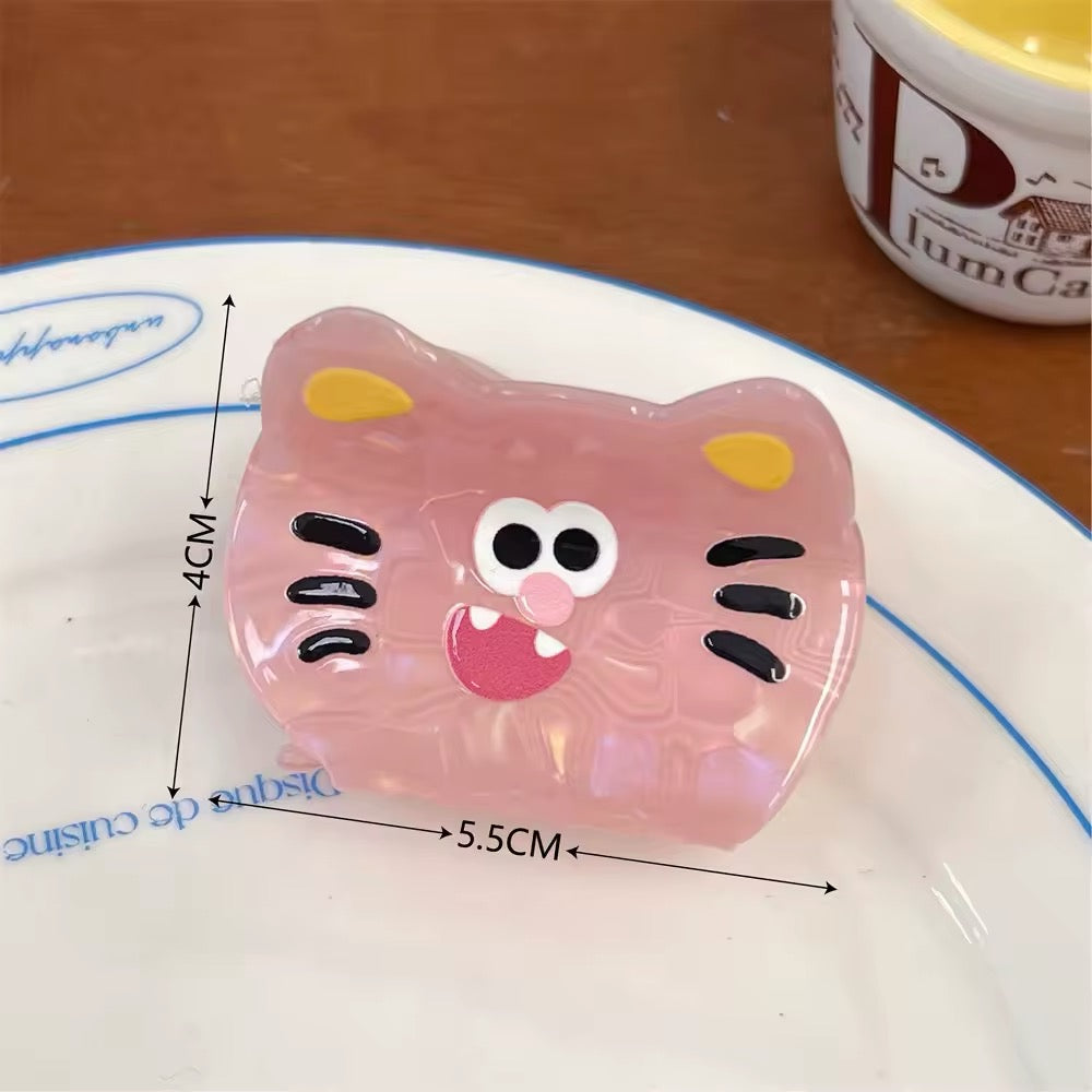 Pink tiger face cartoon clip with exaggerated features designed for sweet girl aesthetics