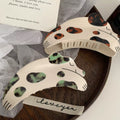 The hair clip securing a model's thick, curly hair in a stylish updo, highlighting its strong hold and design