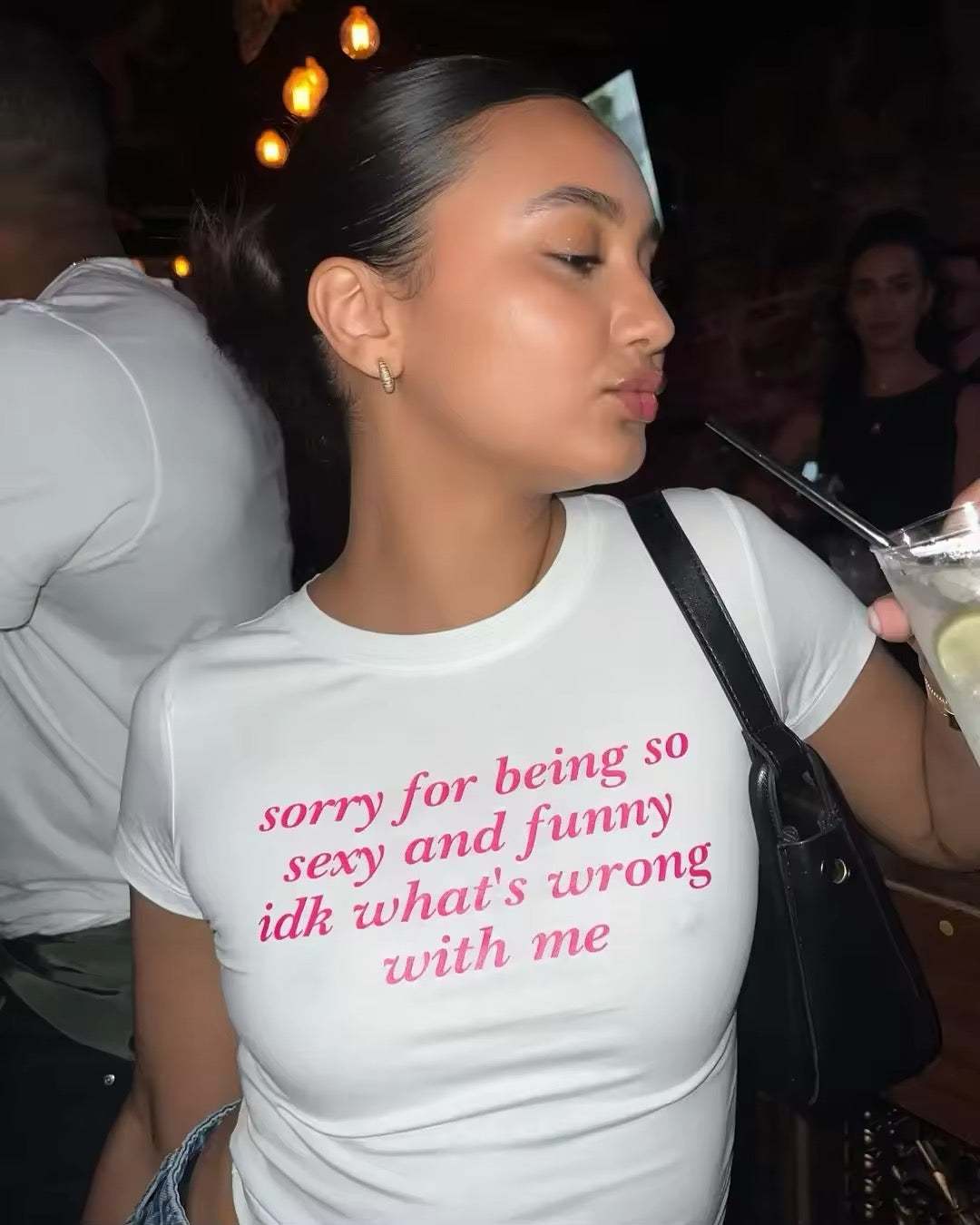 Y2K girl wearing cropped letter print tee in aesthetic streetwear style

