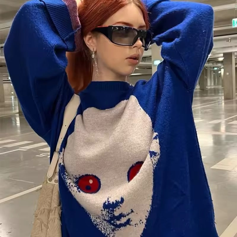 Blue knit sweater featuring a bold white face with red eyes on the front, ideal for Y2K alt fashion