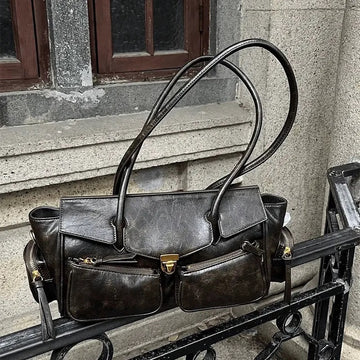 Grunge-style shoulder bag with long strap and Y2K retro vibe