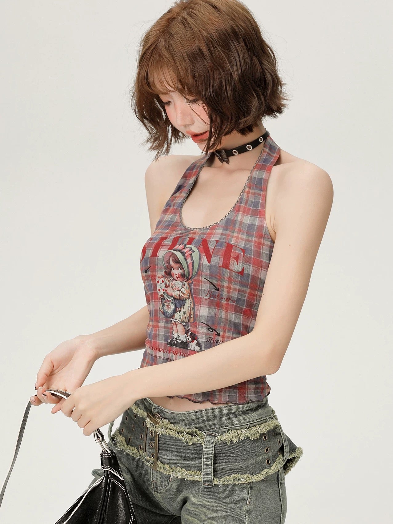 Model wearing the Y2K camisole paired with a pleated skirt, embodying college girl style.